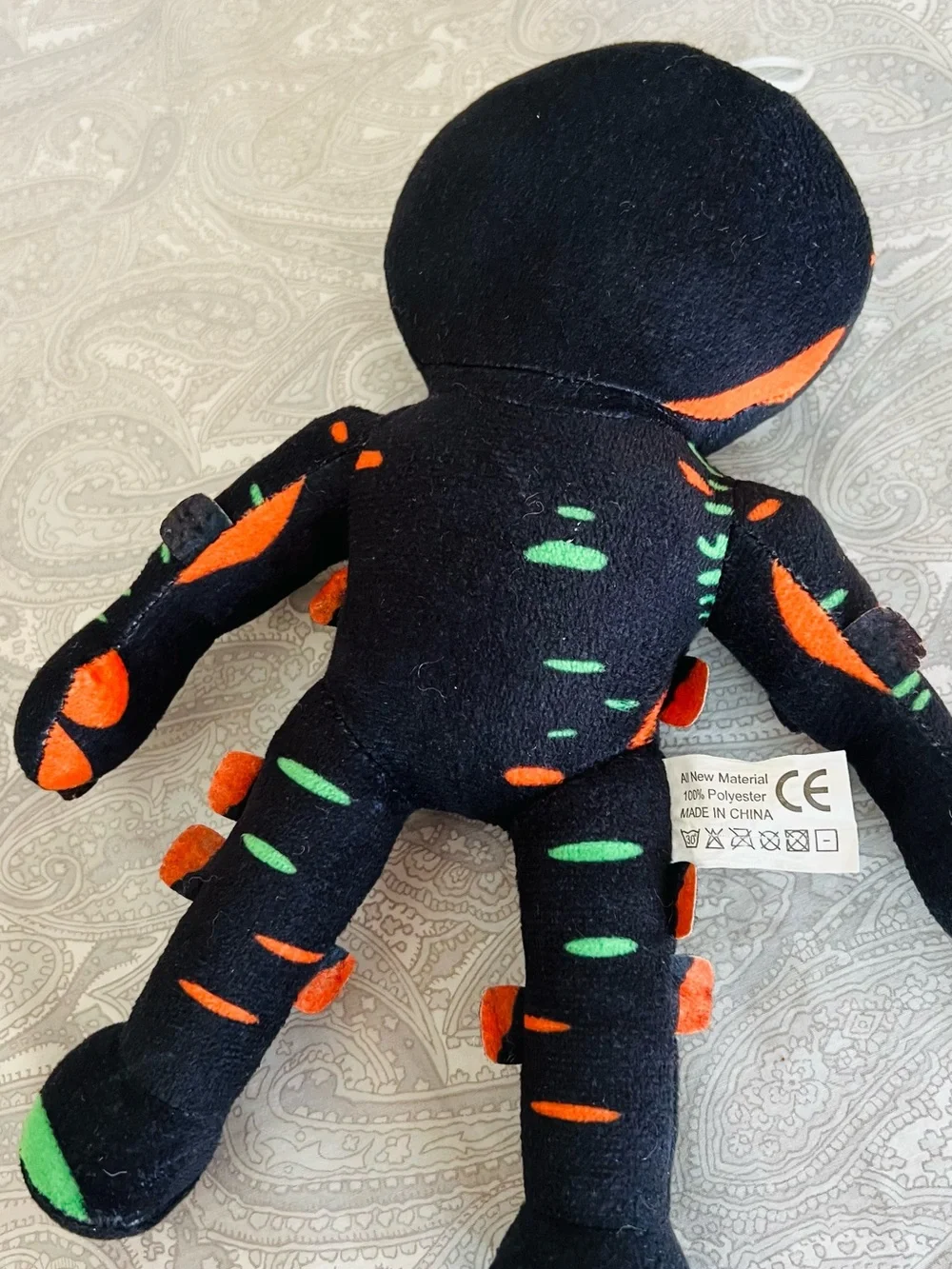 Star Wars plushie & Black Plush Toy with Neon Green & Orange Accents